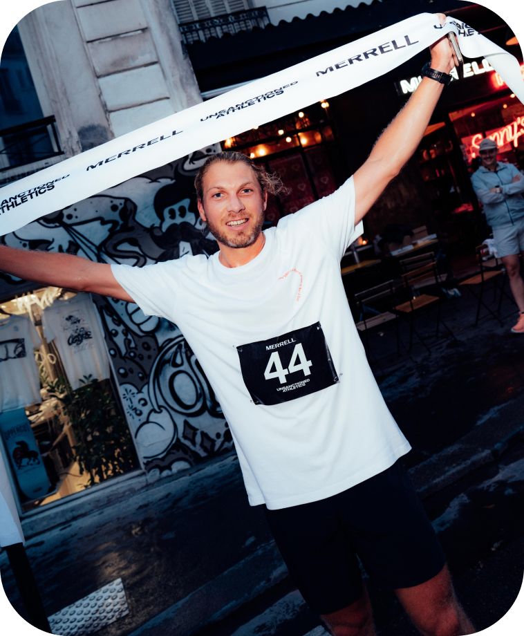 People running a race wearing Merrell ProMorph shoes